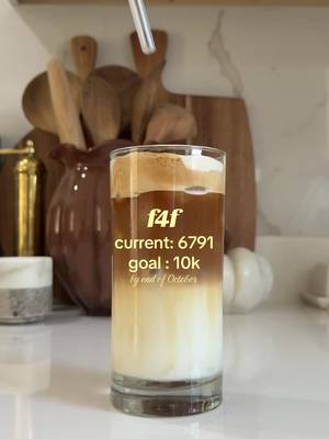 Tall clear glass tumbler with a reusable glass straw