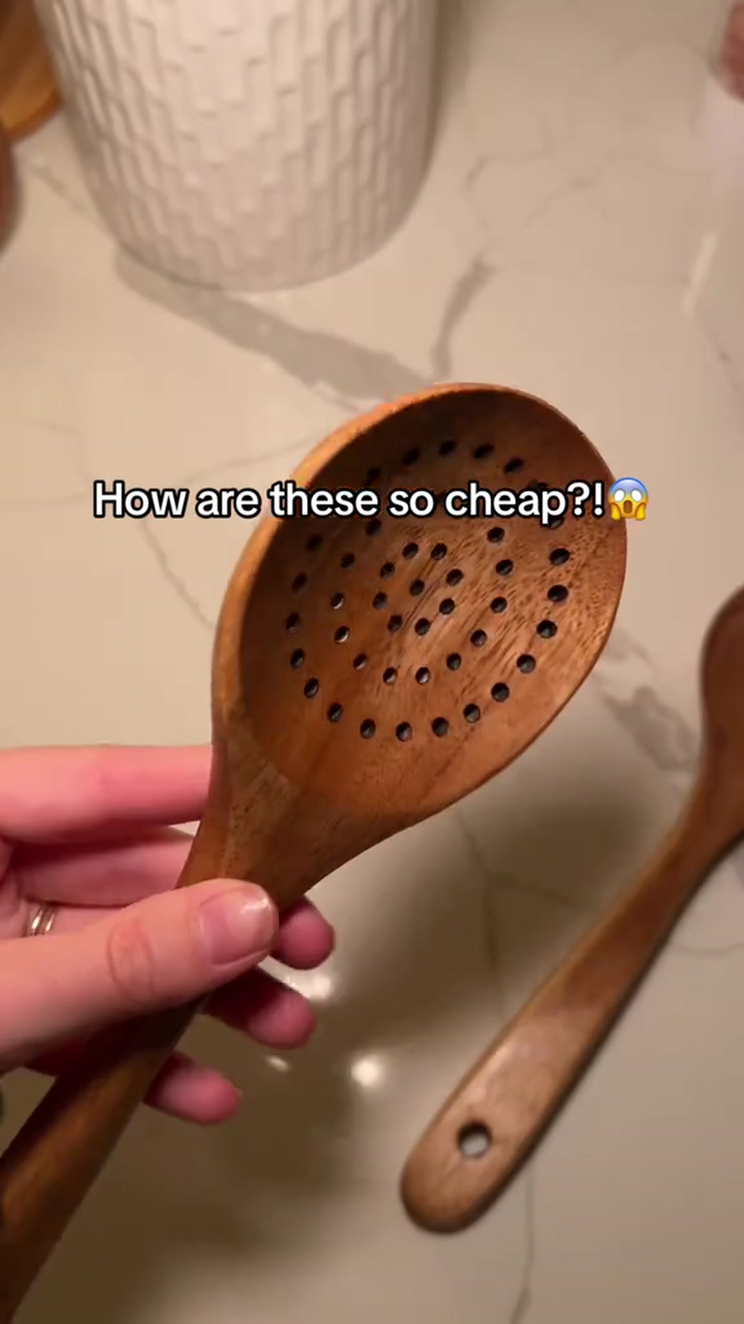 Wooden kitchen utensil set with perforated spoon ladle and spatulas